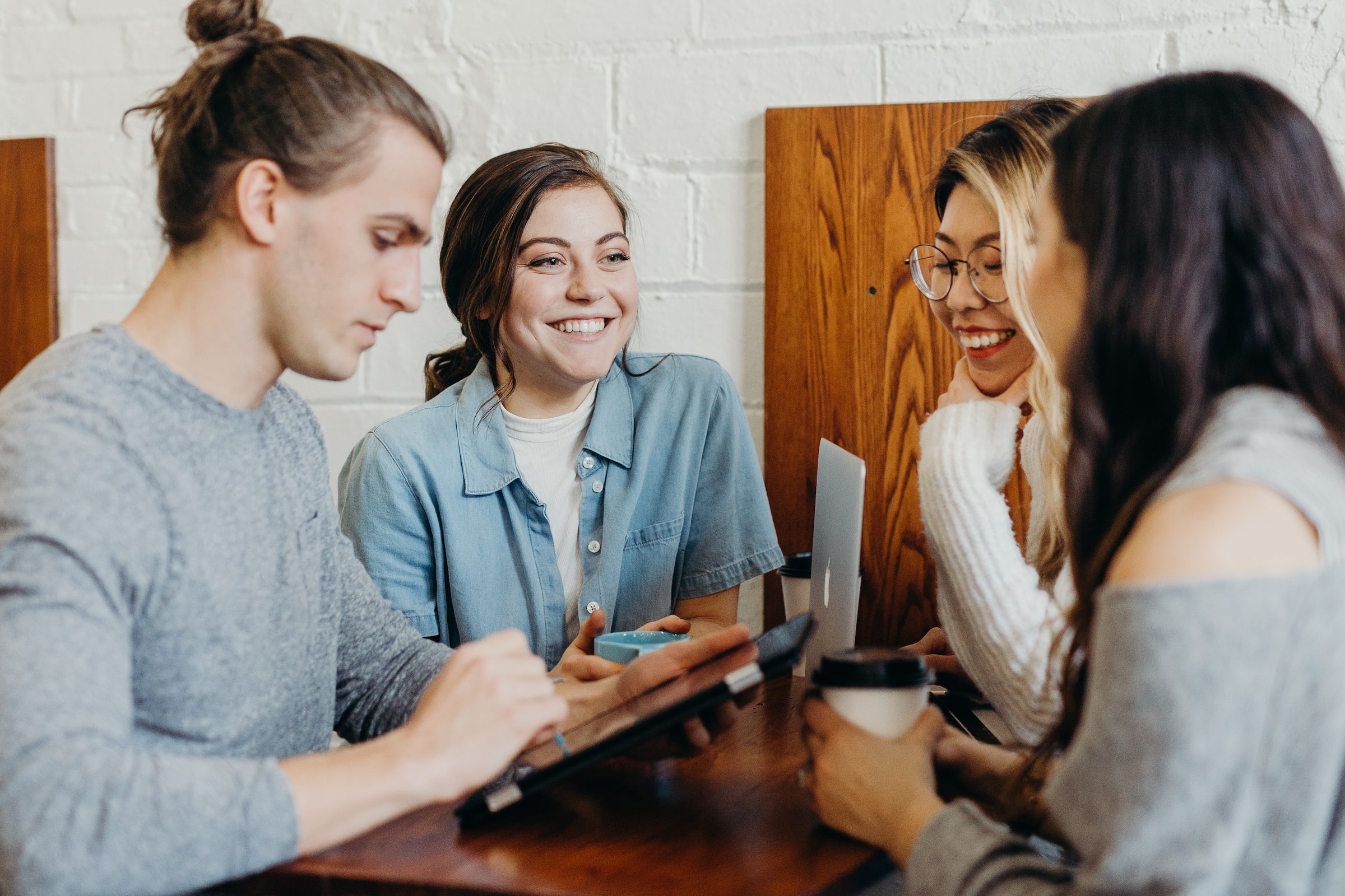 A group of students sitting together and smiling.